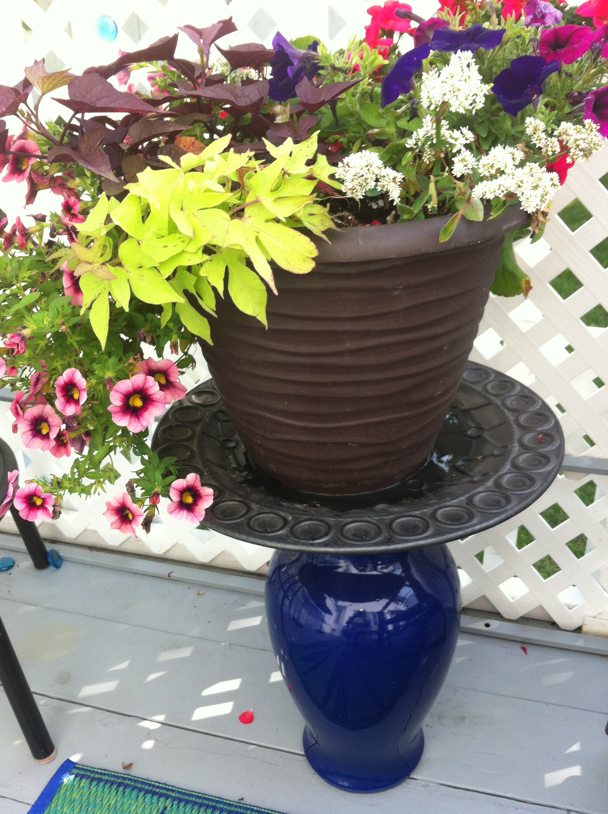 Up-cycled plant stand from vase and platter 8 DIY Patio Accents #trashtotreasure #patio #diy #yard #garden #up-cycle #re-purpose #patio_table #plant_stand #bird_bath #herb_garden
